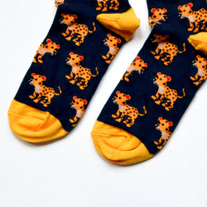 toe closeup flat lay of navy blue bamboo socks featuring leopard designs