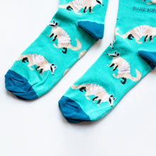 toe closeup flat lay of bright blue numbat socks