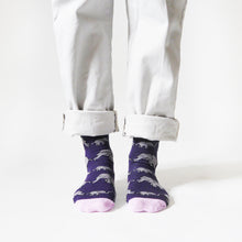 front view of standing model wearing purple and pink elephant bamboo socks