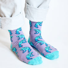 side angle view of standing model wearing lilac and blue frog bamboo socks