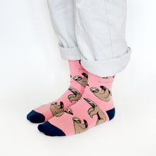 standing model, side angle view, wearing pink sloth socks