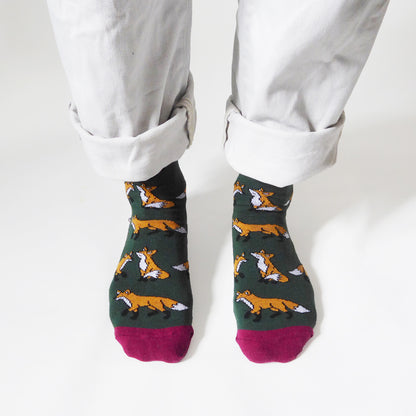 birds eye view of standing model wearing dark green fox socks