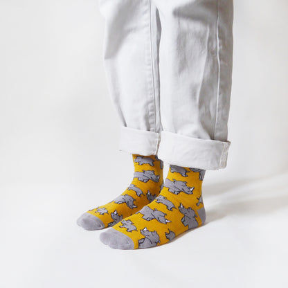 standing model wearing rhino socks, side angle view