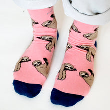 closeup of standing model wearing sloth socks
