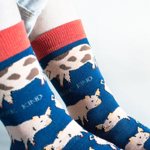 closeup of navy blue bamboo pig socks on model 