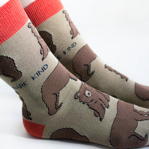 ankle closeup of model wearing brown and red bamboo bear socks