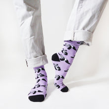 standing model with left heel up wearing lilac and black panda bamboo socks