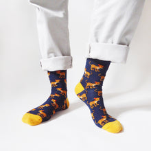 model standing and wearing navy blue leopard bamboo socks