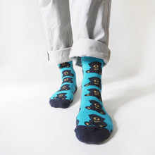 front view of standing model wearing sun bear bamboo socks with left foot forward 