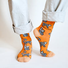 model standing wearing orange lemur bamboo socks