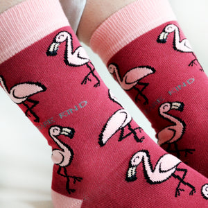 closeup of model wearing hot pink flamingo socks