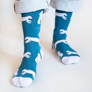 front view of standing model wearing blue and white polar bear socks