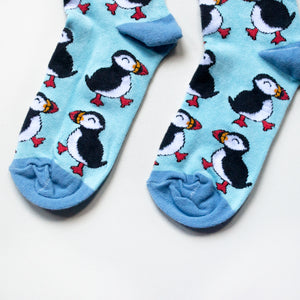 toe closeup flat lay of blue puffin bamboo socks