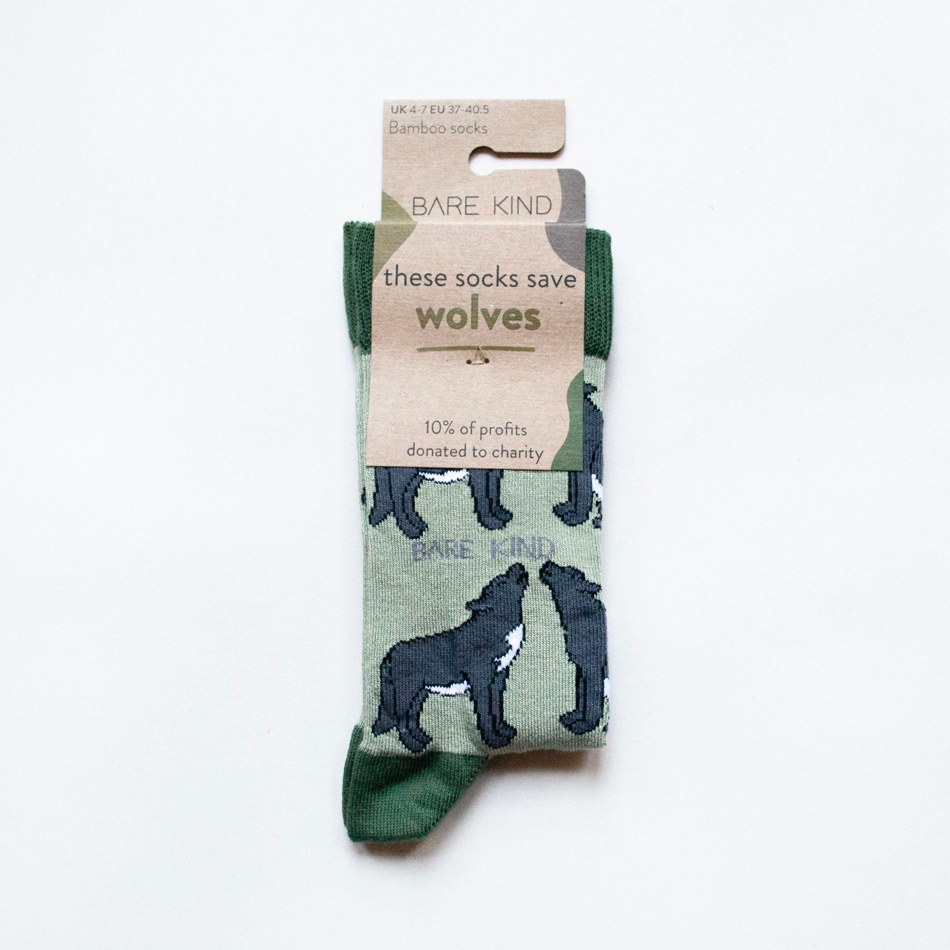 folded flat lay of green bamboo wolf socks in 100% recyclable cardboard packaging