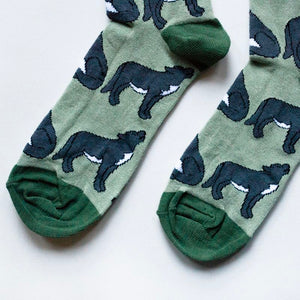 toe closeup flat lay of green bamboo wolf socks