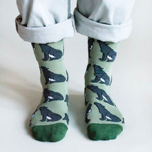 front view of standing model wearing wolf socks